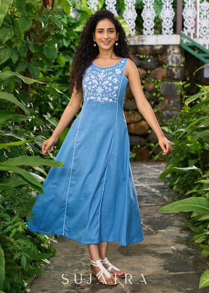 Classy powder blue cotton sleeveless dress highlighted with floral embroidery on the yoke