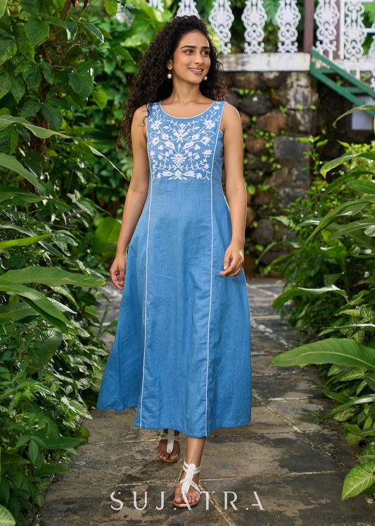 Classy powder blue cotton sleeveless dress highlighted with floral embroidery on the yoke
