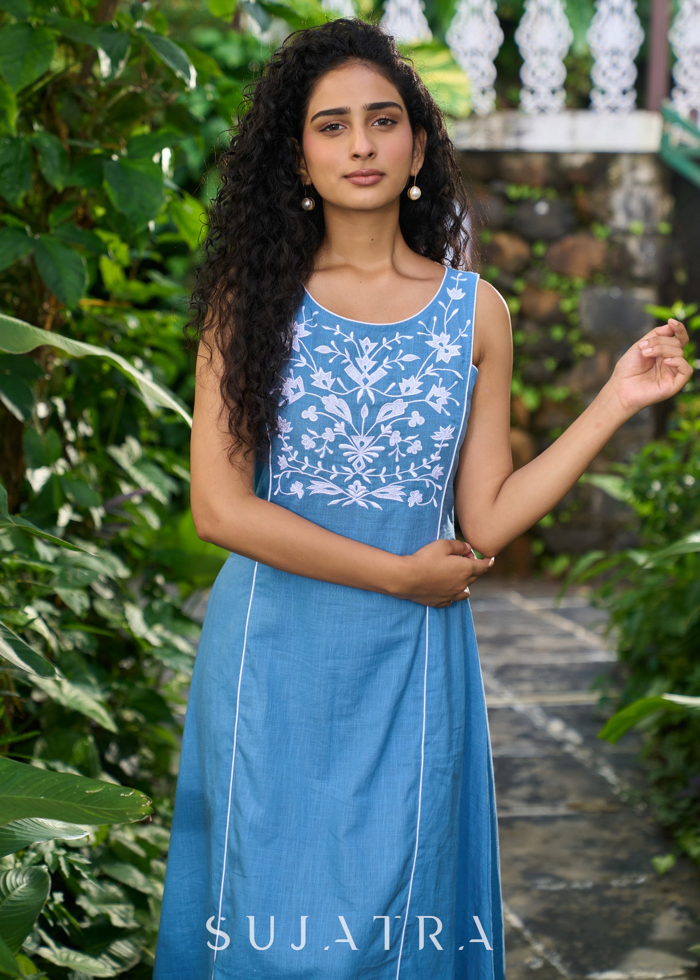 Classy powder blue cotton sleeveless dress highlighted with floral embroidery on the yoke