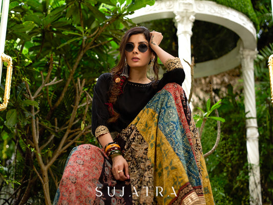 Modern colourful Ajrakh lehenga beautifully contrasted by a sleek black gathered topwear.