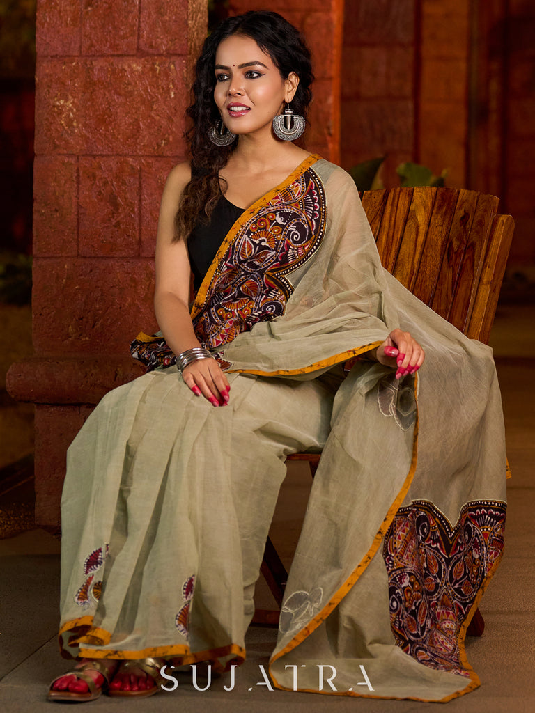 Classic olive Chanderi saree enhanced with heritage batik appliqué