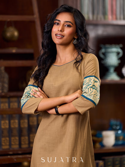 Elegant Beige Cotton A-Line Dress Adorned with Madhubani Border Detailing on Hem and Cuffs