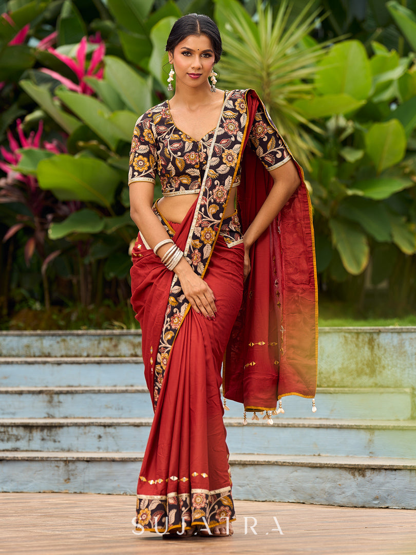 Traditional Rust Modal Silk Saree with Hand Embroidered Mirror Work & Kalamkari Printed Border