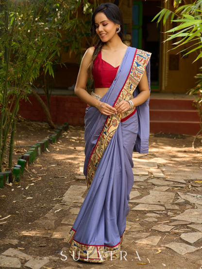 Dusty blue modal blend saree with handcrafted Madhubani border and artistic finesse