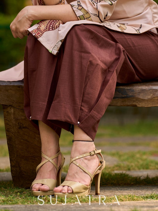 Stylish brown pleated pants with clean pleats and a polished finish