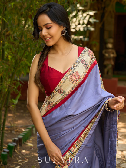 Dusty blue modal blend saree with handcrafted Madhubani border and artistic finesse