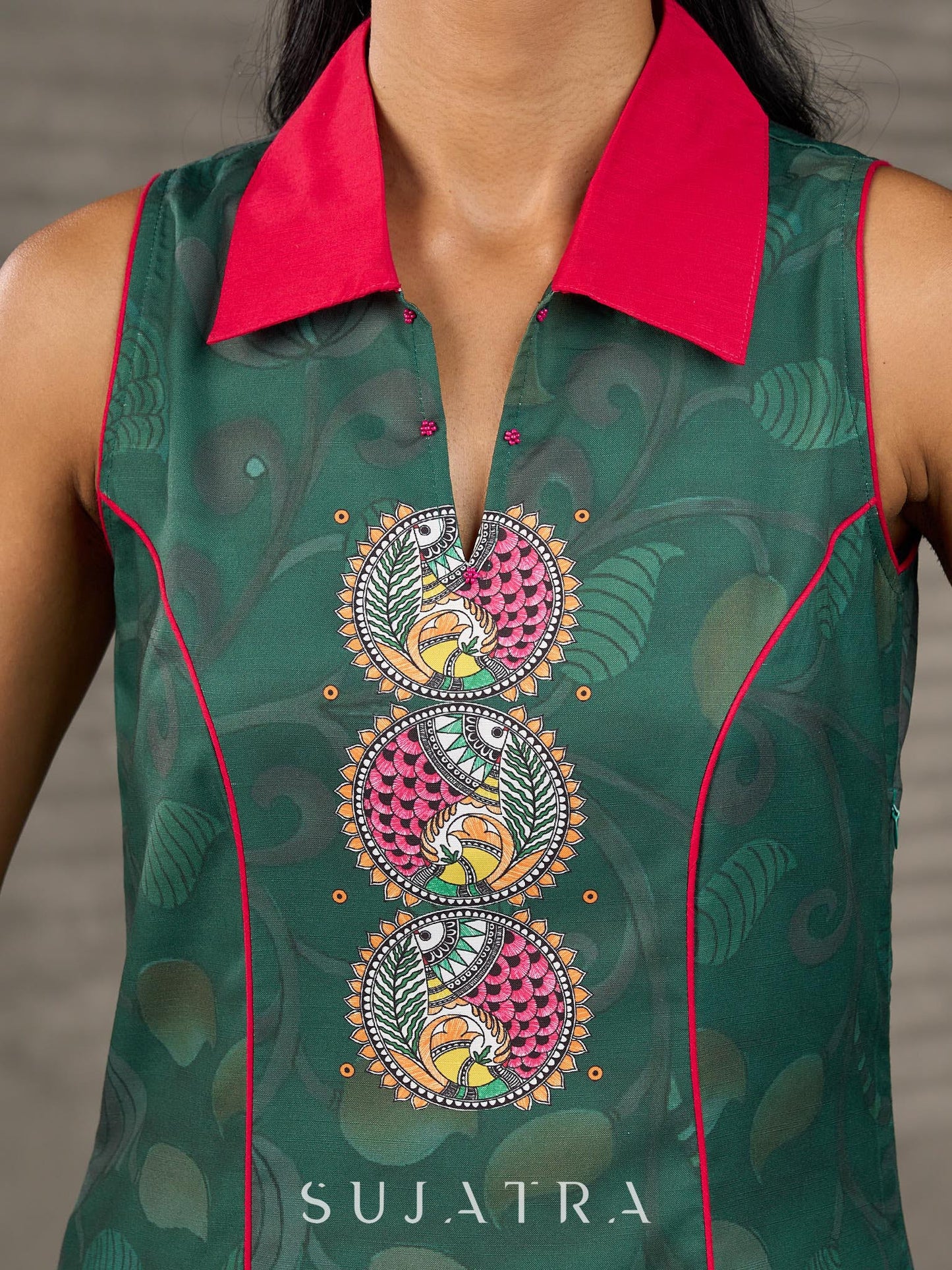 Bottle green Madhubani printed dress with vibrant magenta accents.