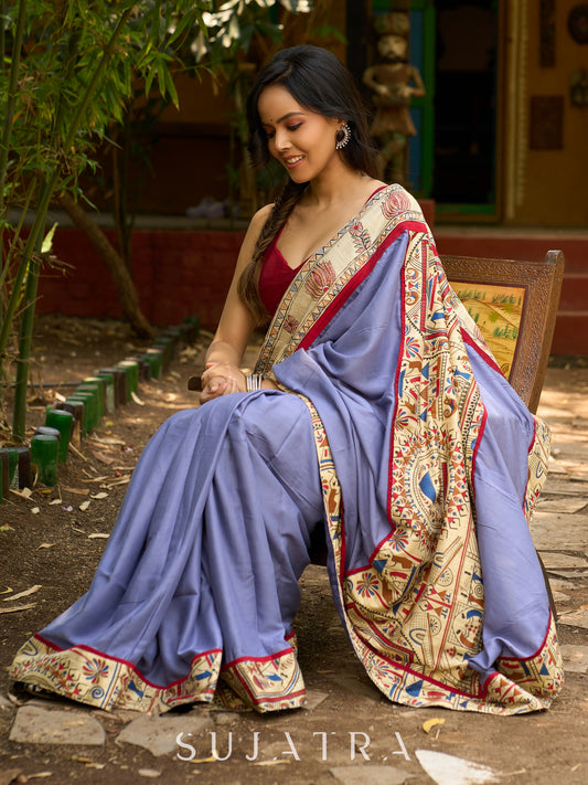 Dusty blue modal blend saree with handcrafted Madhubani border and artistic finesse