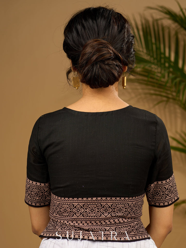 Trendy combination of black cotton ajrakh blouse .