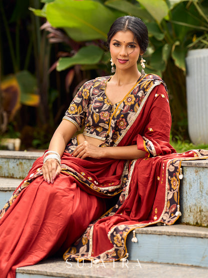 Traditional Rust Modal Silk Saree with Hand Embroidered Mirror Work & Kalamkari Printed Border