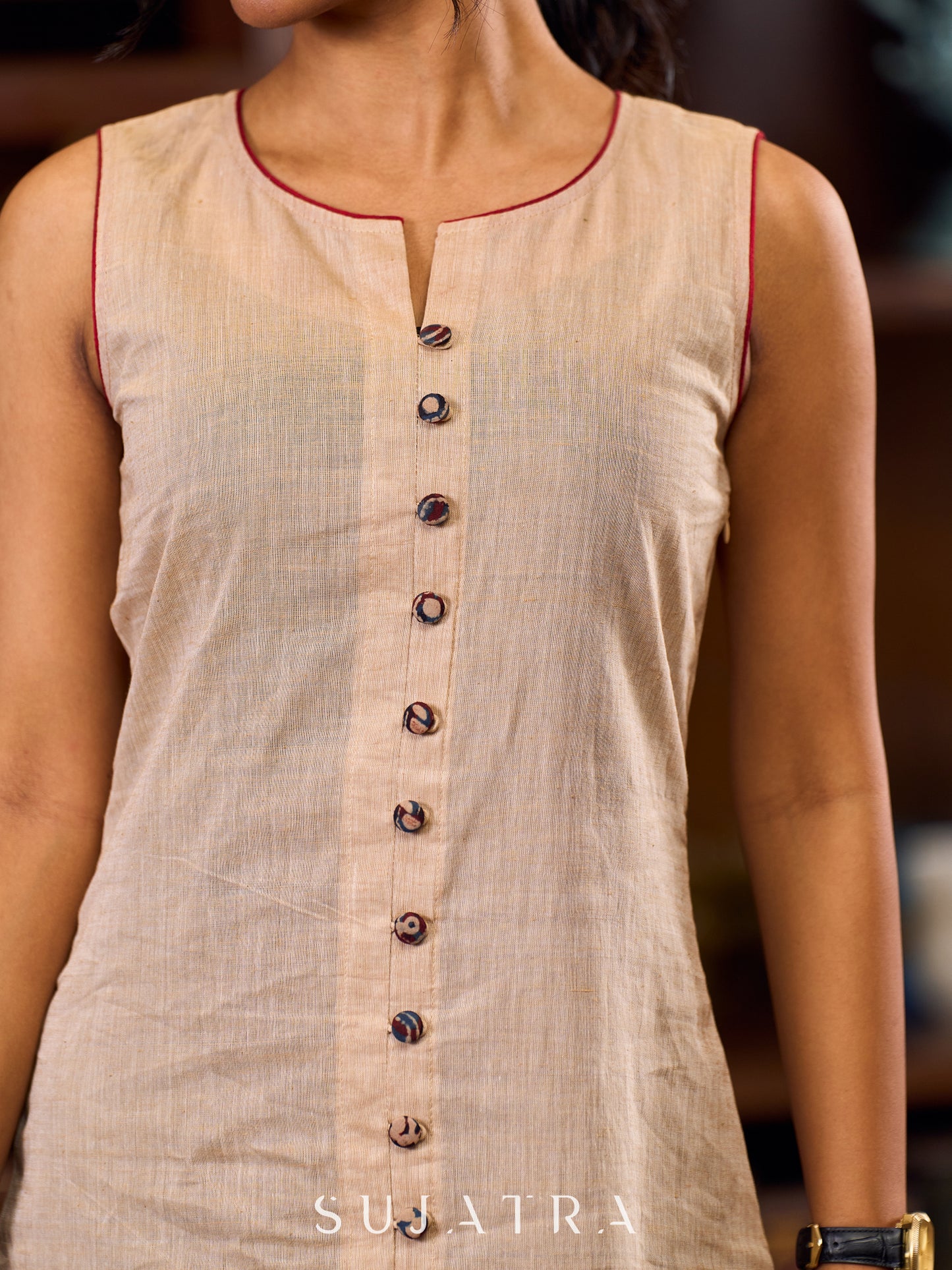 Charming Beige A-Line Dress With Ajrakh Border, Maroon Touches And Statement Buttons