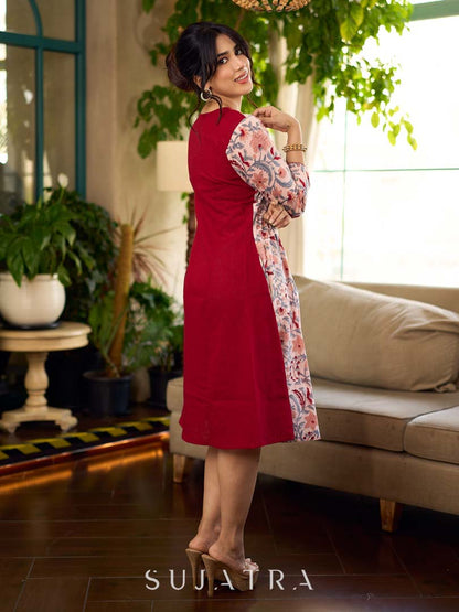 Jaipur-printed maroon floral crossover dress featuring a wrap-style silhouette with a coordinating floral tie-up, creating a flattering cinched waist and a breezy, feminine flow.