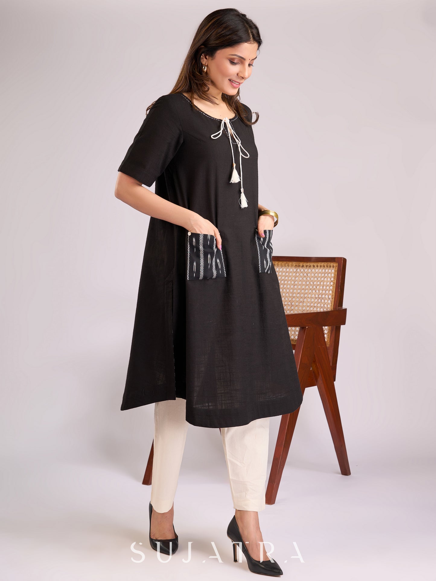 Timeless Black Cotton Kurta with Ikat Pockets, Kantha Handwork & Tassel-Tied Neckline