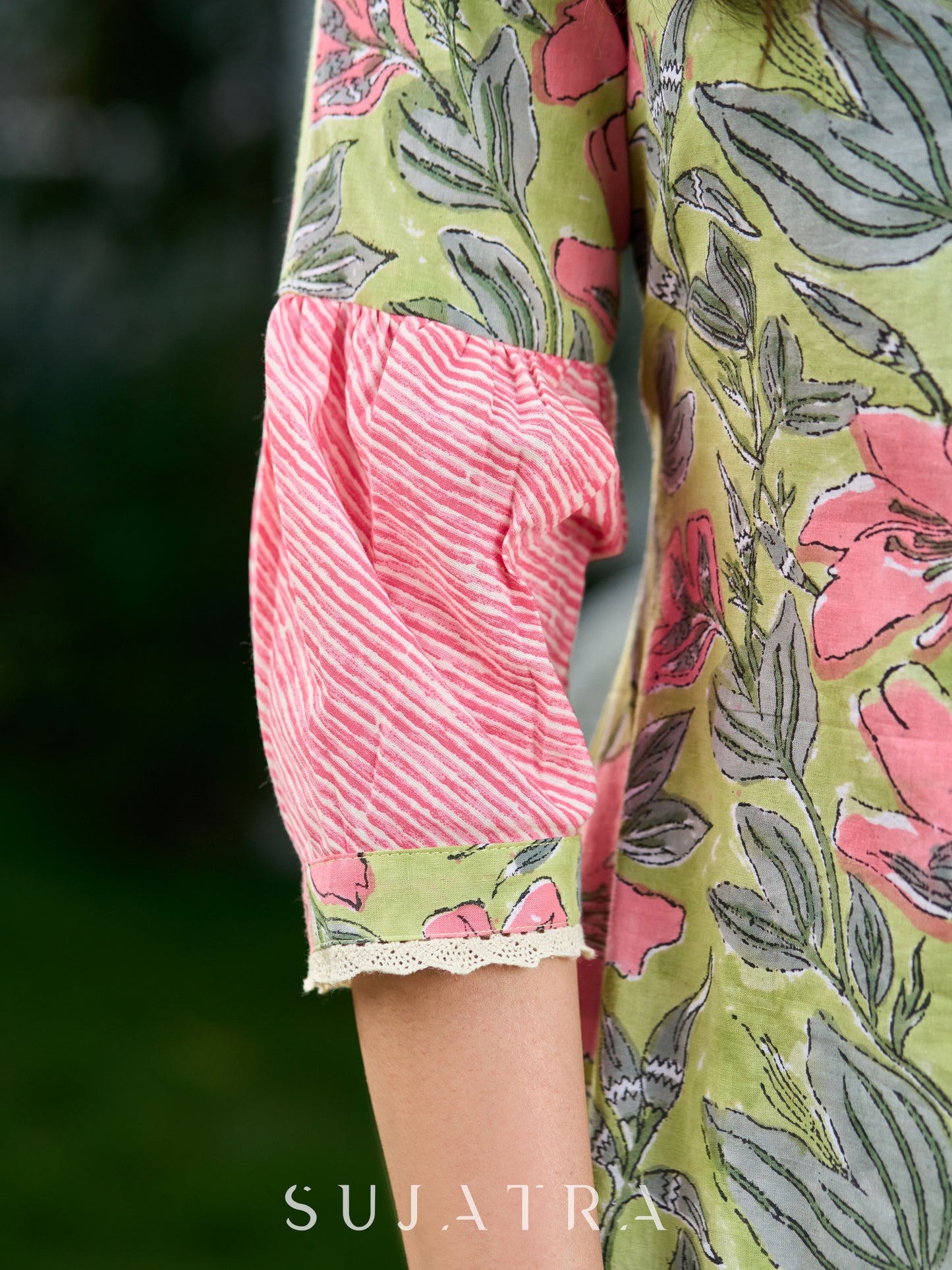 Graceful Pista Green Dress with Contrasting Pink Touches and Lace Detailing