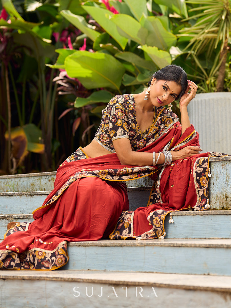 Traditional Rust Modal Silk Saree with Hand Embroidered Mirror Work & Kalamkari Printed Border
