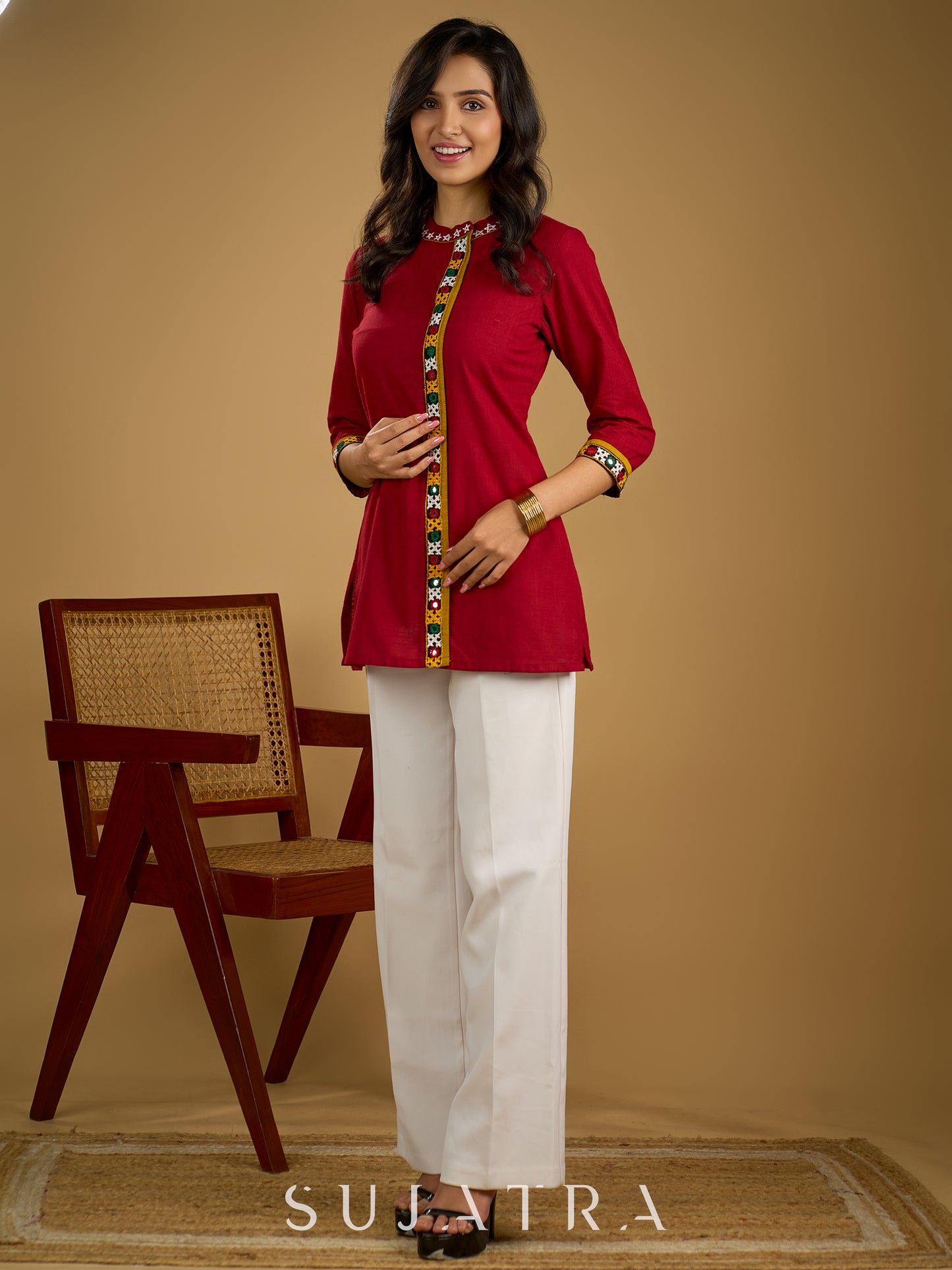 Elegant maroon cotton top featuring mirror work and side collar.