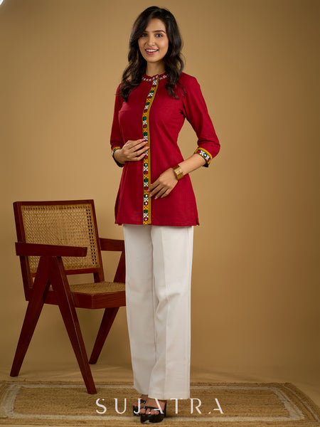 Elegant maroon cotton top featuring mirror work and side collar.