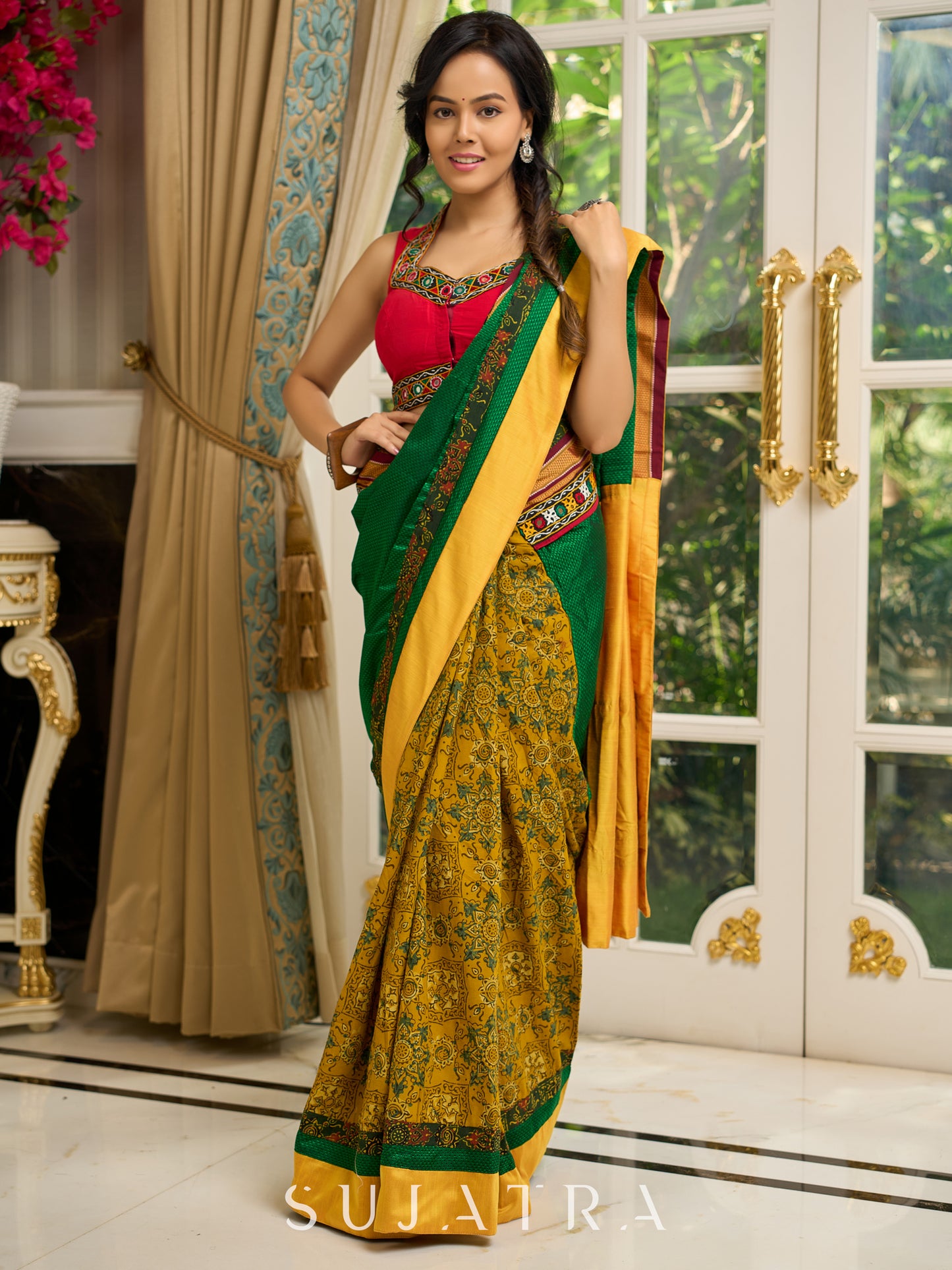 Vibrant Khun-Ajrakh fusion cotton saree with bold block prints and mirrorwork