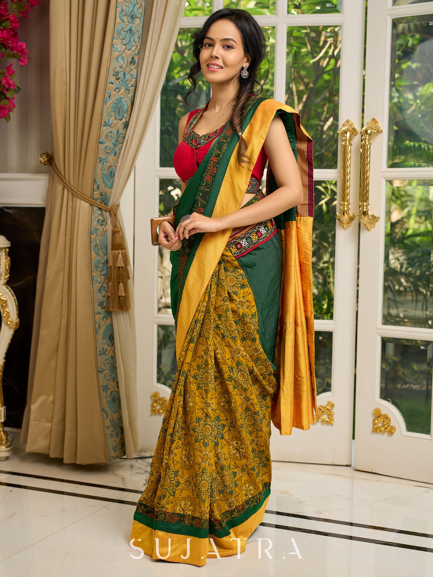 Vibrant Khun-Ajrakh fusion cotton saree with bold block prints and mirrorwork