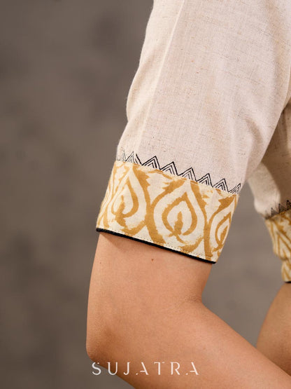 Off White and Mustard Elbow Sleeve Blouse with Contrast Piping and Hand Painted Gond Art on Back