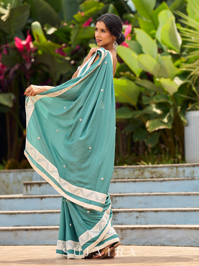Vibrant Sea Green Modal Saree with Ivory Chevron Border & Minimal Hand Embroidery