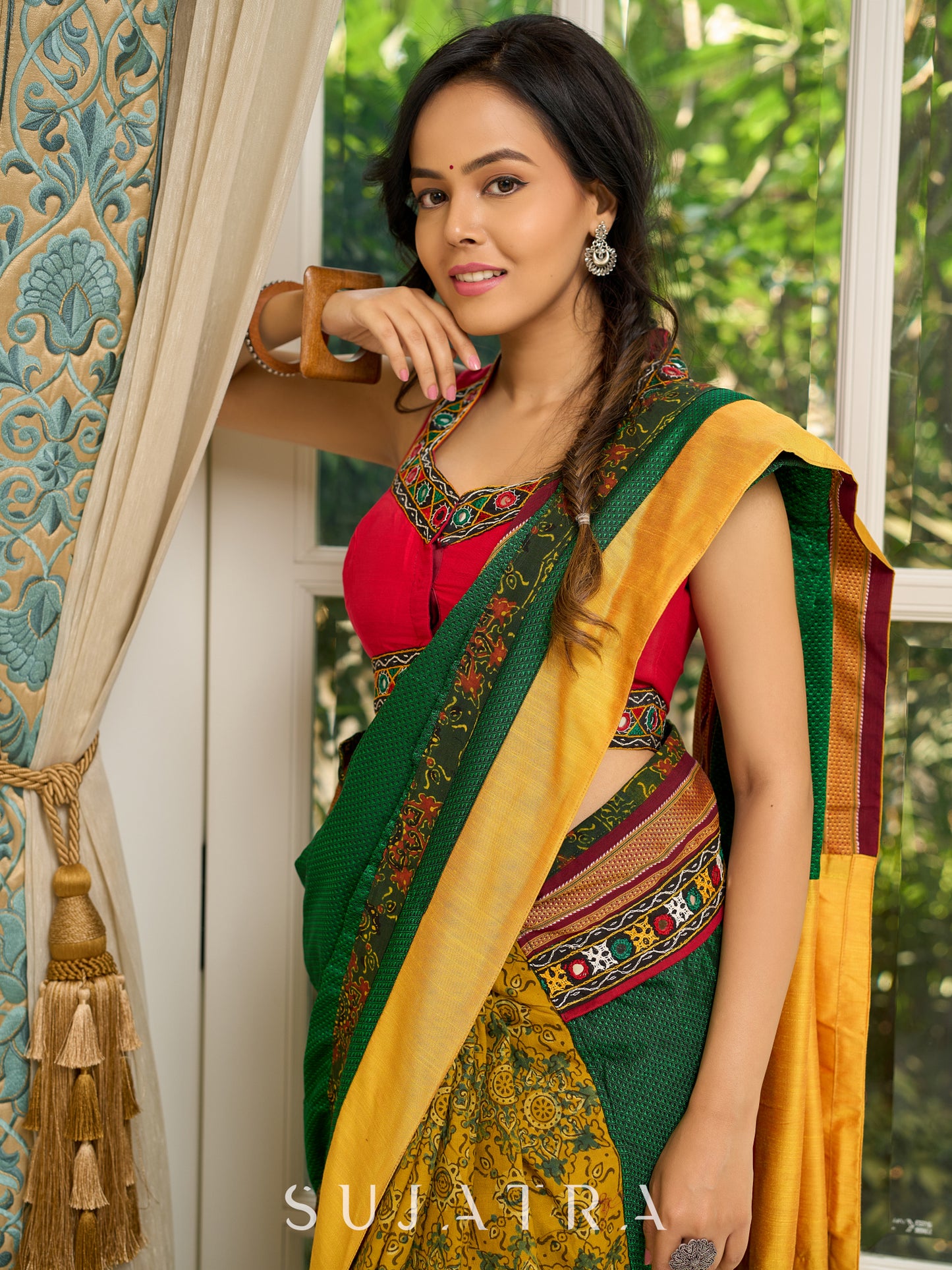 Vibrant Khun-Ajrakh fusion cotton saree with bold block prints and mirrorwork