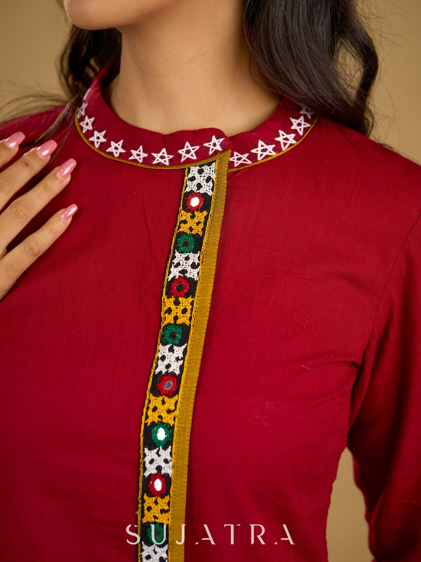 Elegant maroon cotton top featuring mirror work and side collar.