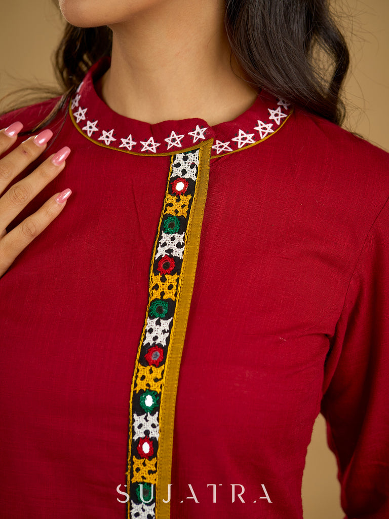 Elegant maroon cotton top featuring mirror work and side collar.