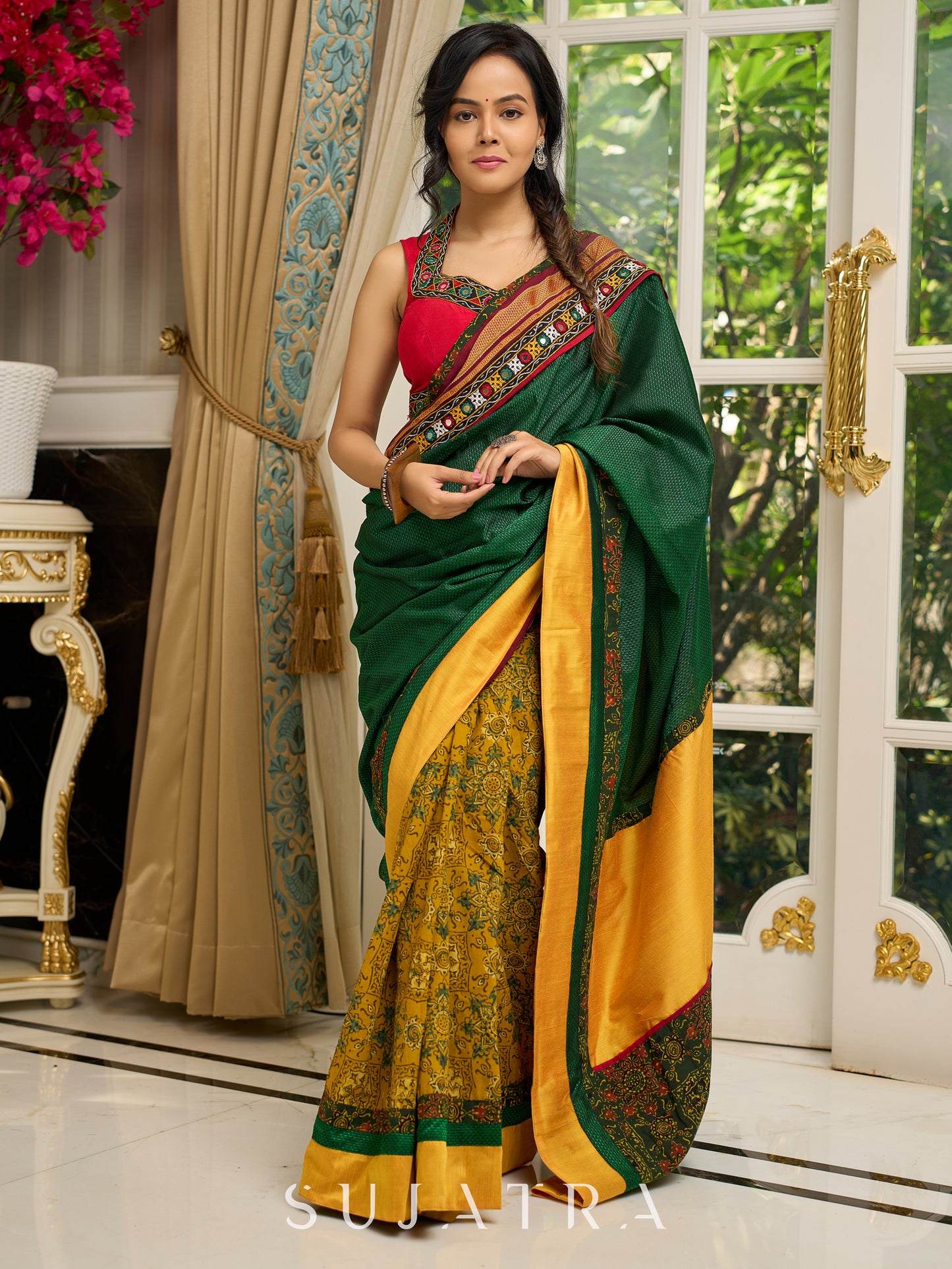 Vibrant Khun-Ajrakh fusion cotton saree with bold block prints and mirrorwork