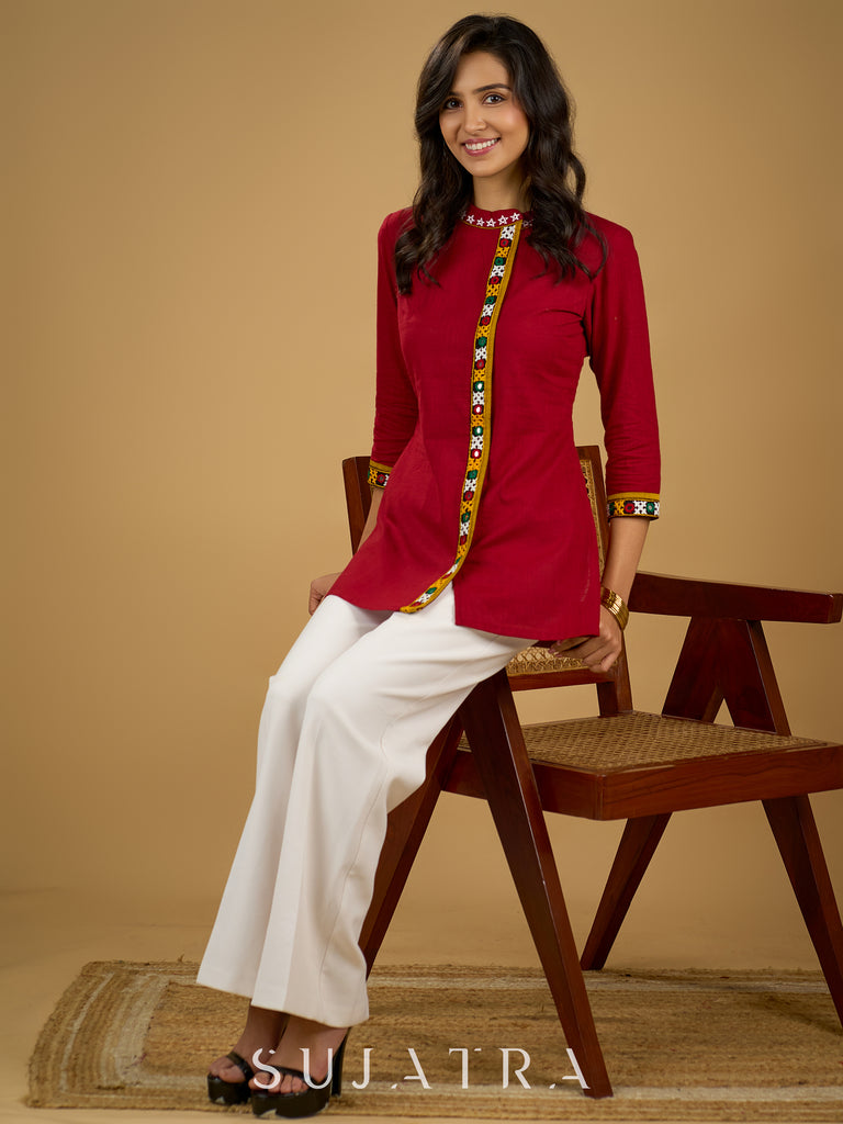 Elegant maroon cotton top featuring mirror work and side collar.