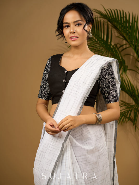 Stunning black cotton hand embroidered blouse with warli printed sleeve.