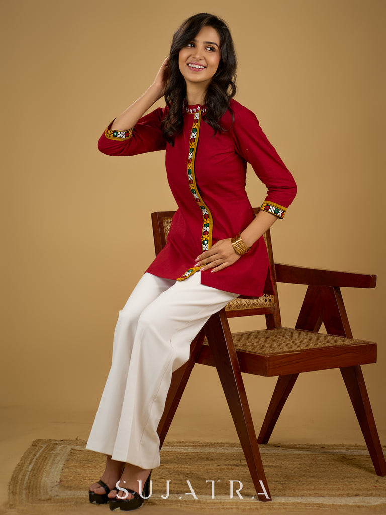 Elegant maroon cotton top featuring mirror work and side collar.