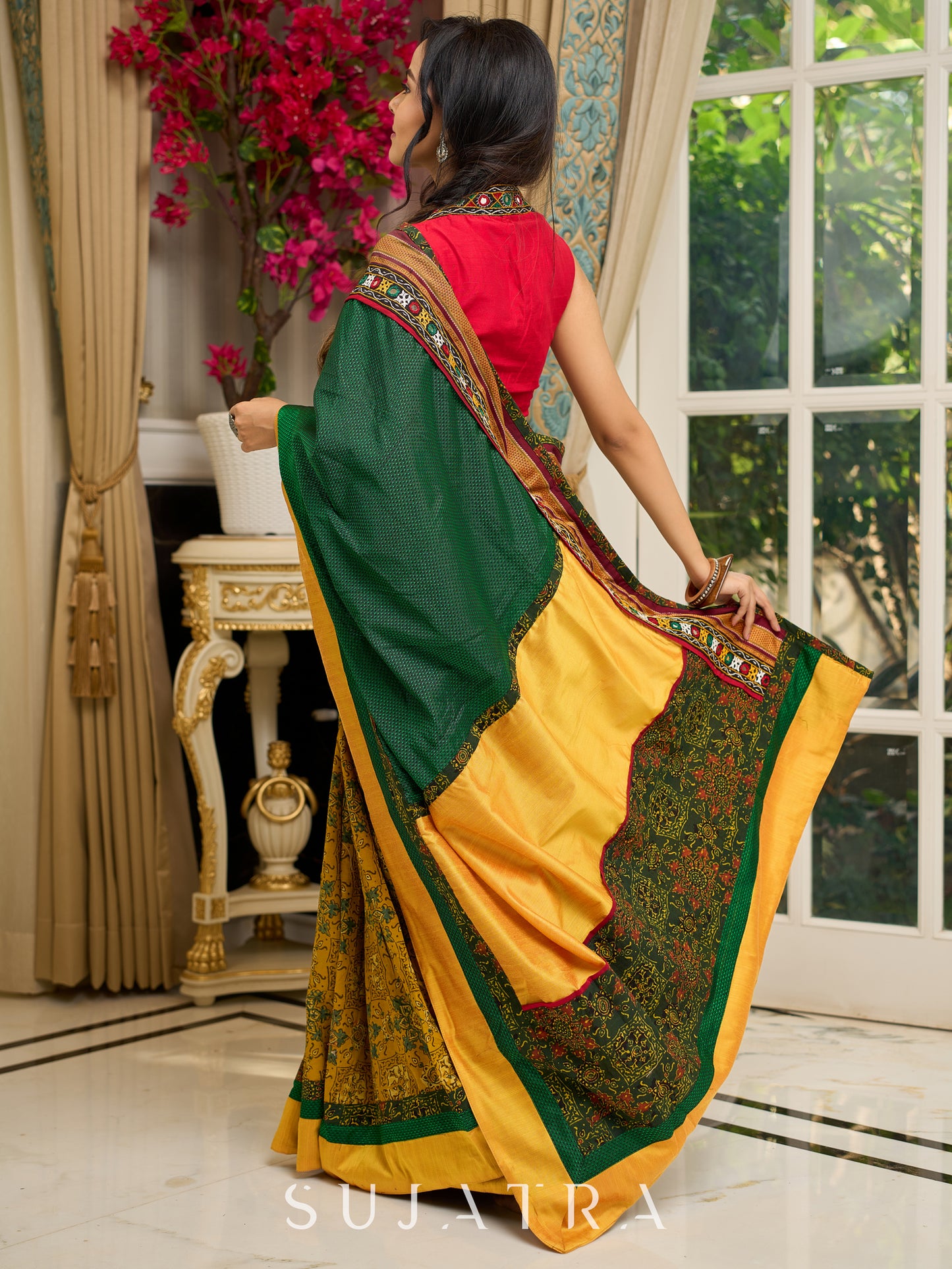 Vibrant Khun-Ajrakh fusion cotton saree with bold block prints and mirrorwork