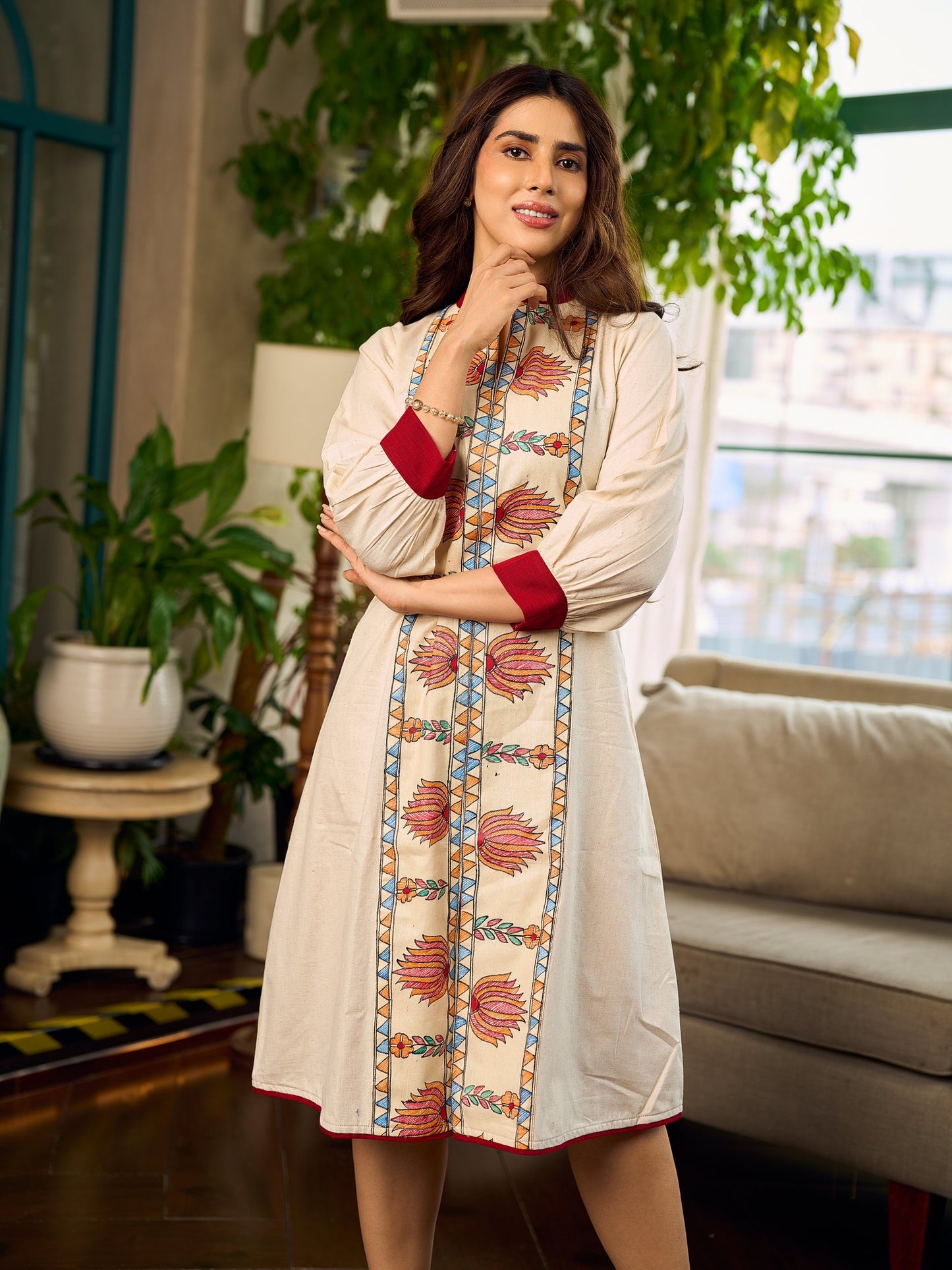 Artisan-crafted off-white Madhubani dress with beautiful hand-painted motifs and trim.