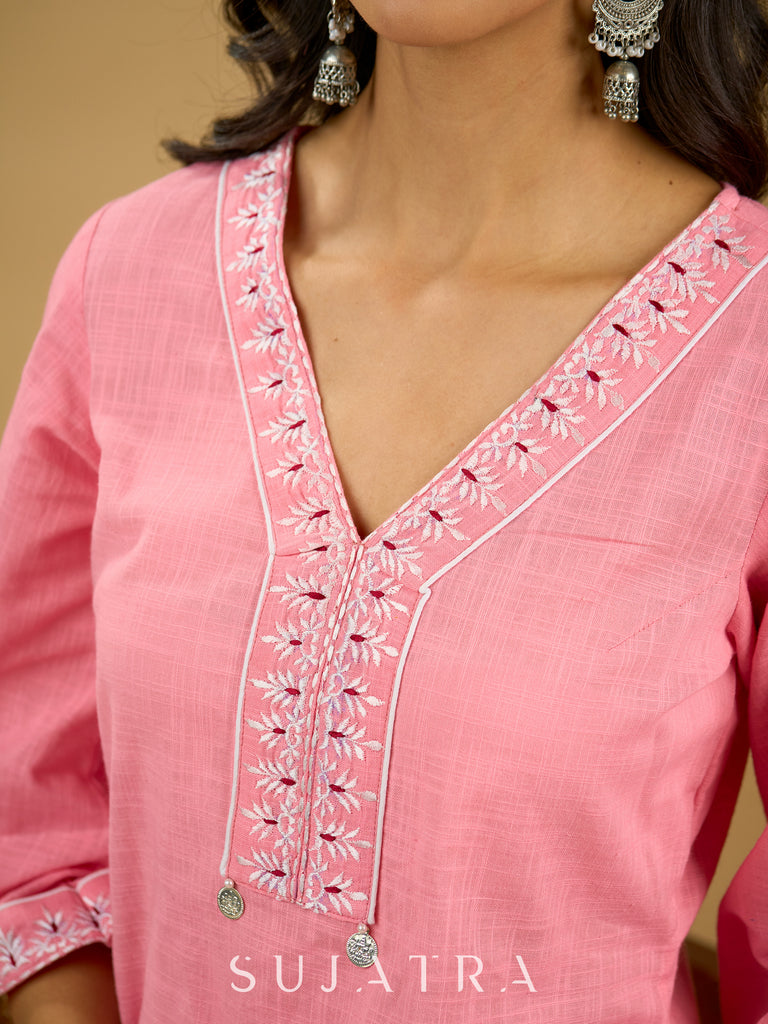 Elegant baby pink cotton top highlighted with subtle thread embroidery