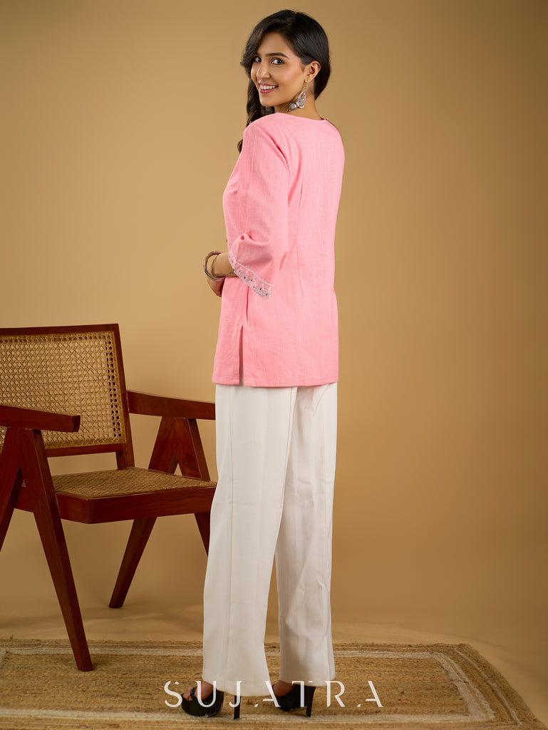Elegant baby pink cotton top highlighted with subtle thread embroidery