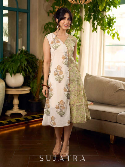Jaipur-printed sleeveless dress featuring a half-and-half butta and jaal combination, designed with an overlapping silhouette, soft drop shoulders, and wooden accents for an artisanal, contemporary look.