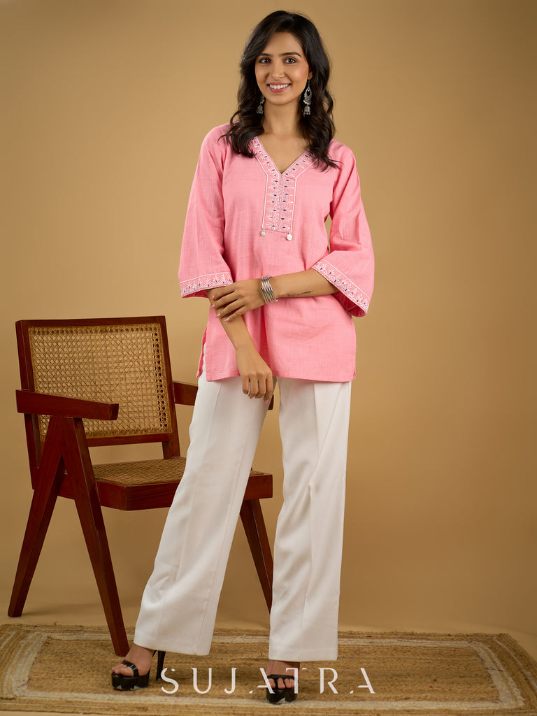 Elegant baby pink cotton top highlighted with subtle thread embroidery