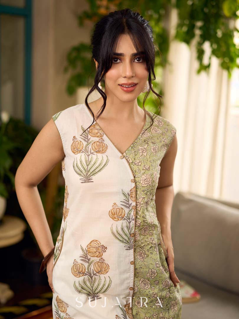 Jaipur-printed sleeveless dress featuring a half-and-half butta and jaal combination, designed with an overlapping silhouette, soft drop shoulders, and wooden accents for an artisanal, contemporary look.