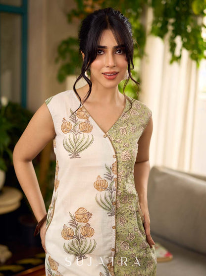 Jaipur-printed sleeveless dress featuring a half-and-half butta and jaal combination, designed with an overlapping silhouette, soft drop shoulders, and wooden accents for an artisanal, contemporary look.