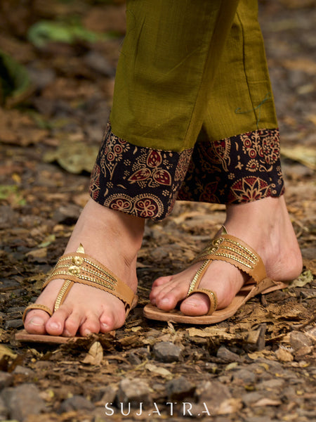 Chic olive pants finished with an artisanal Ajrakh border.