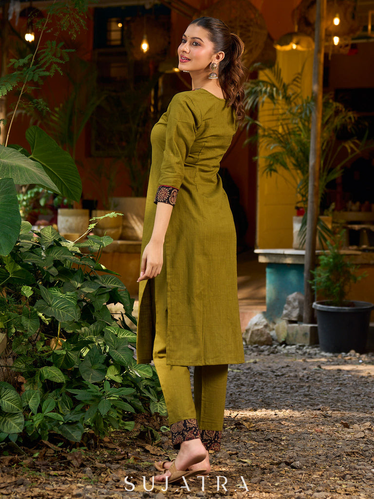 Olive kurta elevated with a black Ajrakh centre panel and Maroon details