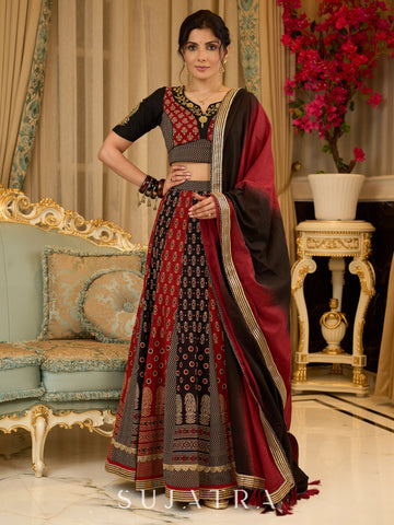 Handcrafted maroon & black Ajrakh print lehenga paired with an embroidered blouse for rich artisanal look - Dupatta Optional