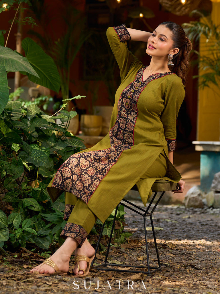 Olive kurta elevated with a black Ajrakh centre panel and Maroon details