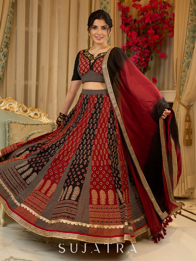 Handcrafted maroon & black Ajrakh print lehenga paired with an embroidered blouse for rich artisanal look - Dupatta Optional