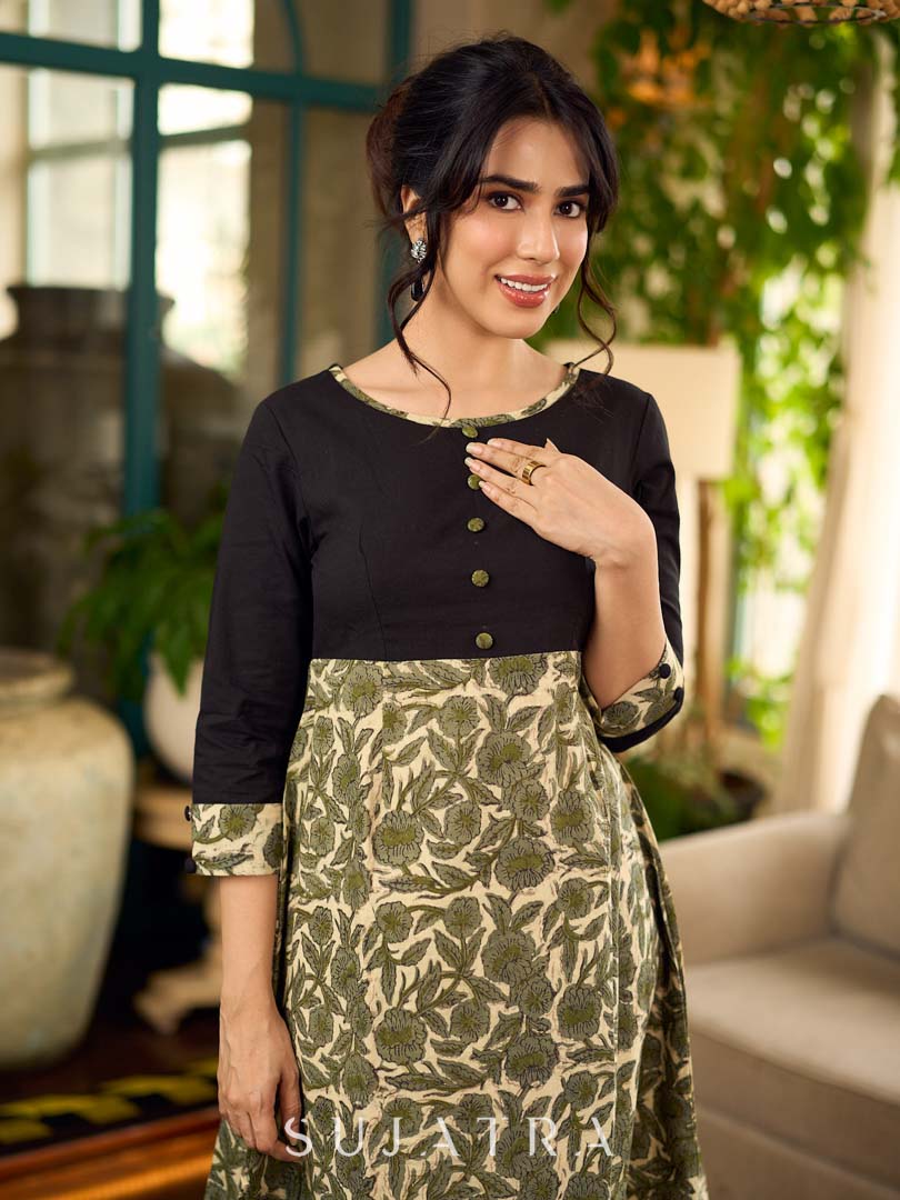 Olive floral dress featuring a contrasting black yoke, designed in a straight fit and highlighted with subtle floral accents for a clean, elegant earthy look