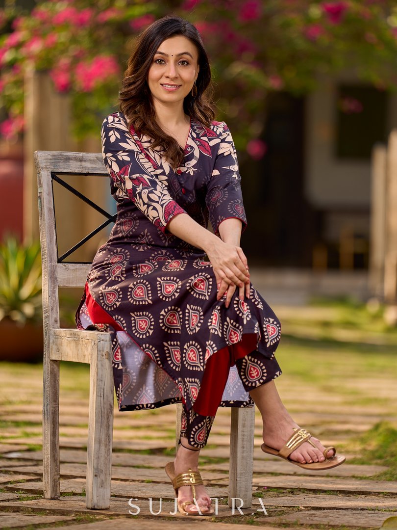 Statement black kurta with Kalamkari-inspired ombré prints and vibrant red touches.