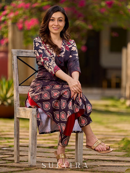 Statement black kurta with Kalamkari-inspired ombré prints and vibrant red touches.