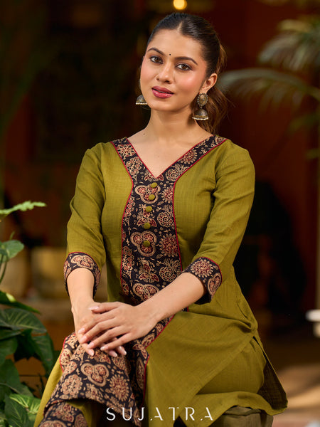 Olive kurta elevated with a black Ajrakh centre panel and Maroon details