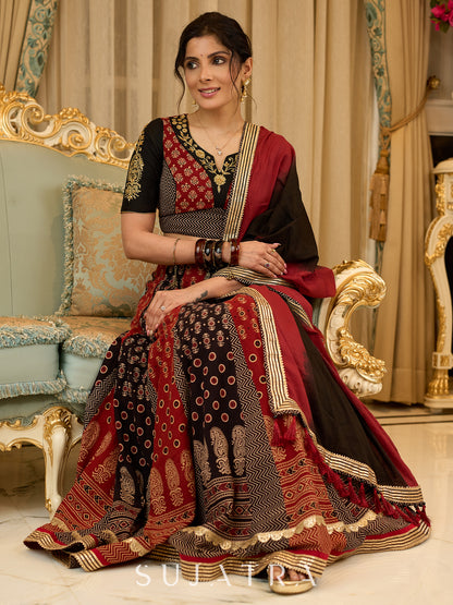 Handcrafted maroon & black Ajrakh print lehenga paired with an embroidered blouse for rich artisanal look - Dupatta Optional